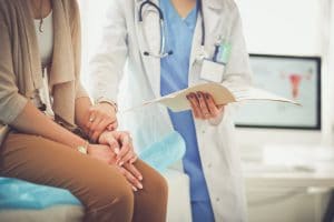 doctor consulting female patient during appointment 