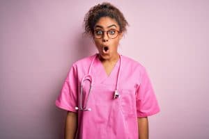 shocked nurse reacting to the cons of travel nursing
