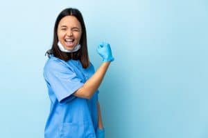 excited nurse thinking about the pros to travel nursing