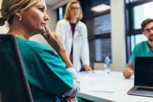 Nurse listening to understand in a meeting