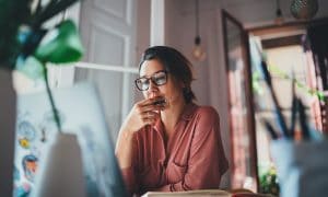 woman researching on her computer