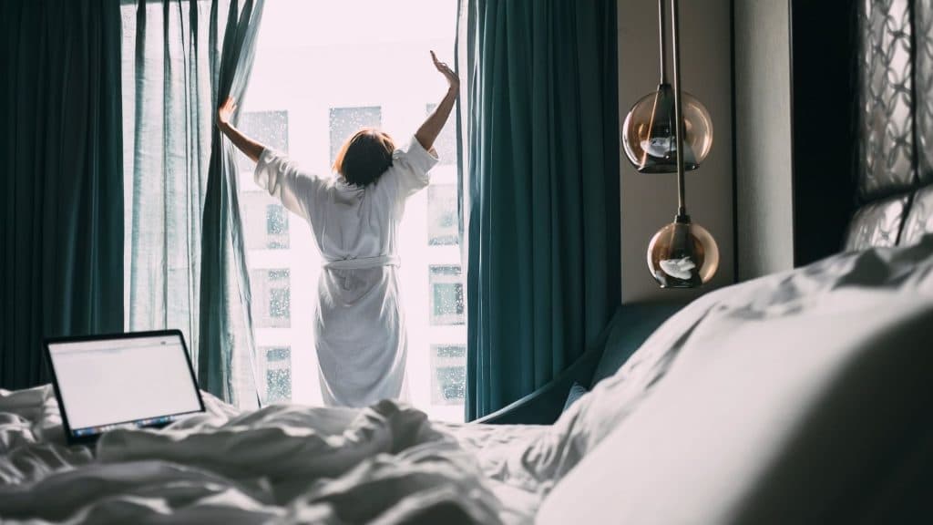 Woman stretching in hotel room