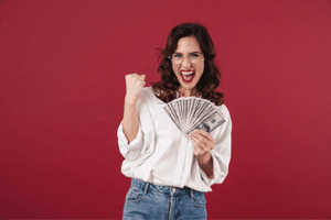 Girl smiling and happy with money in her hands