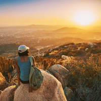 A Woman Overlooking California and at the Sunset