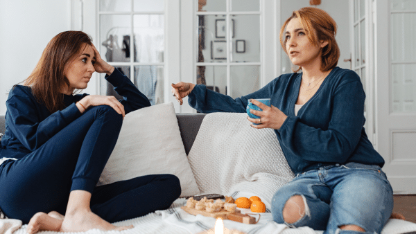 talking with a friend on the couch